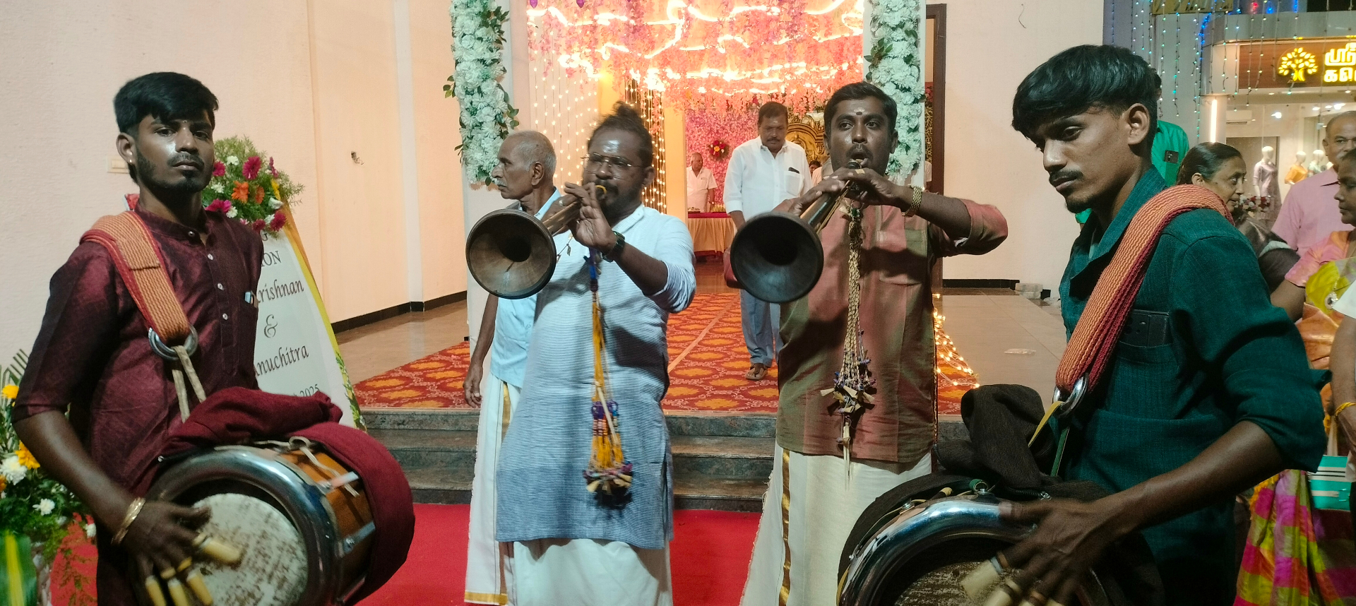 Nadaswaram quartet performing at illuminated wedding entry